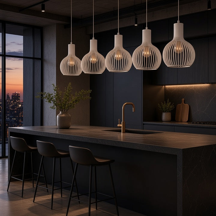 A modern kitchen interior with a large island, dark cabinetry, pendant lights, and a city skyline view at dusk through floor-to-ceiling windows.
